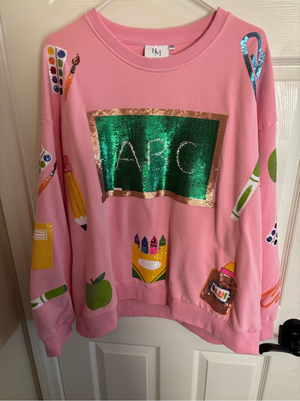 Pink “ teacher” themed sweatshirt! Sequins are gorgeous! Used like new condition